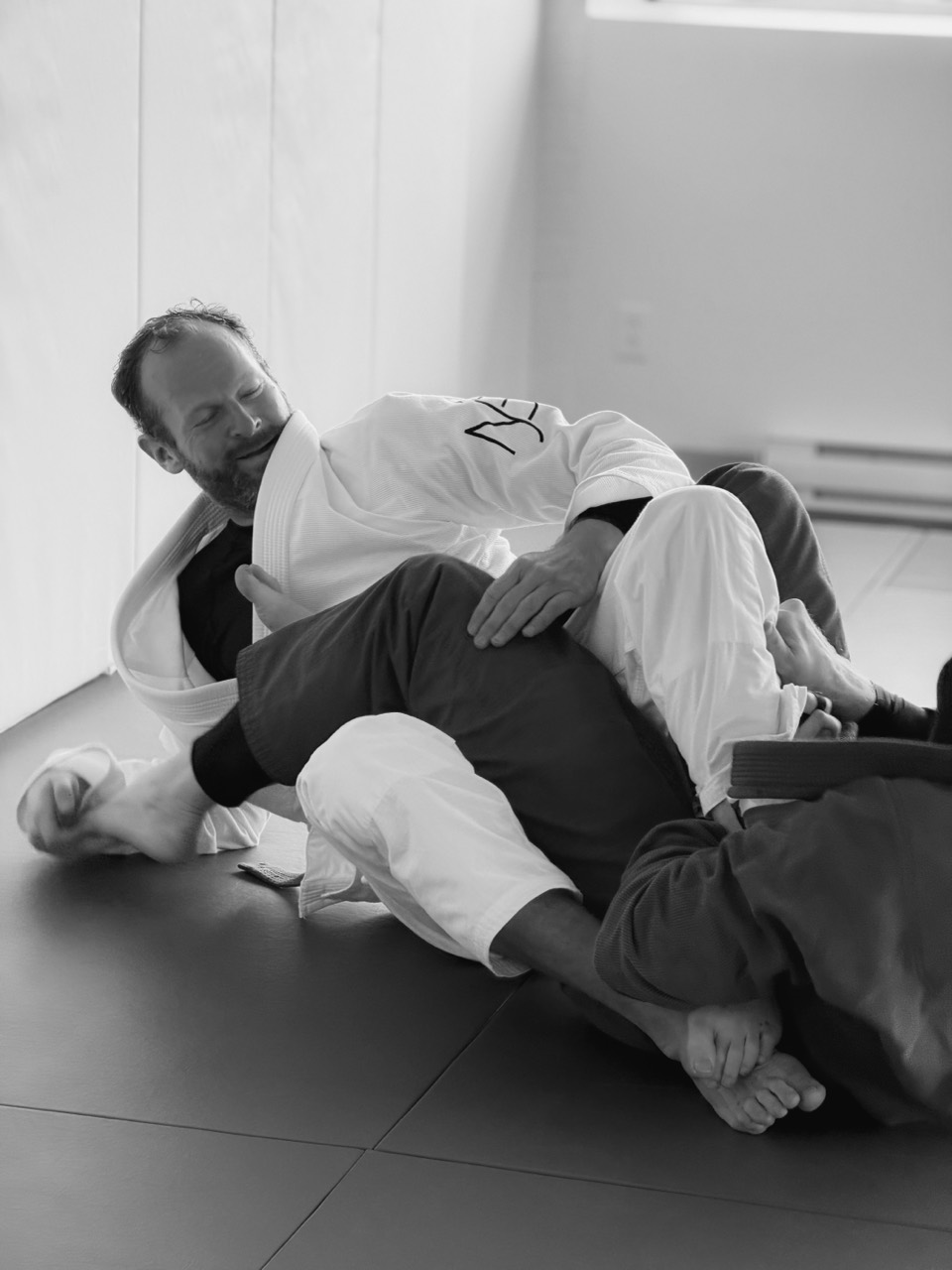 Students practicing controlled guard work near the window