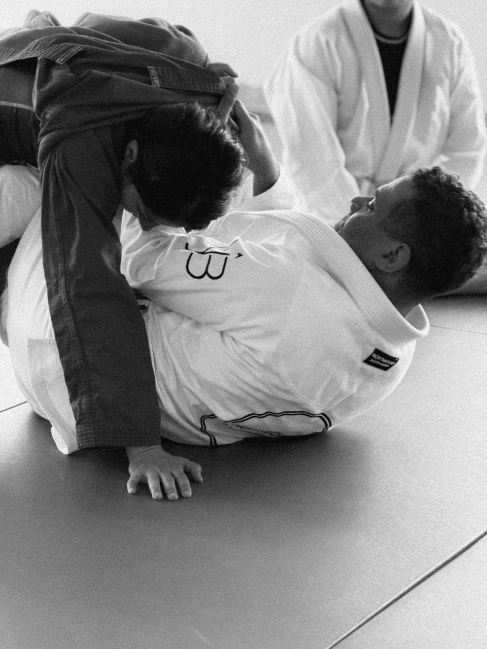 Students drilling a guard position in class